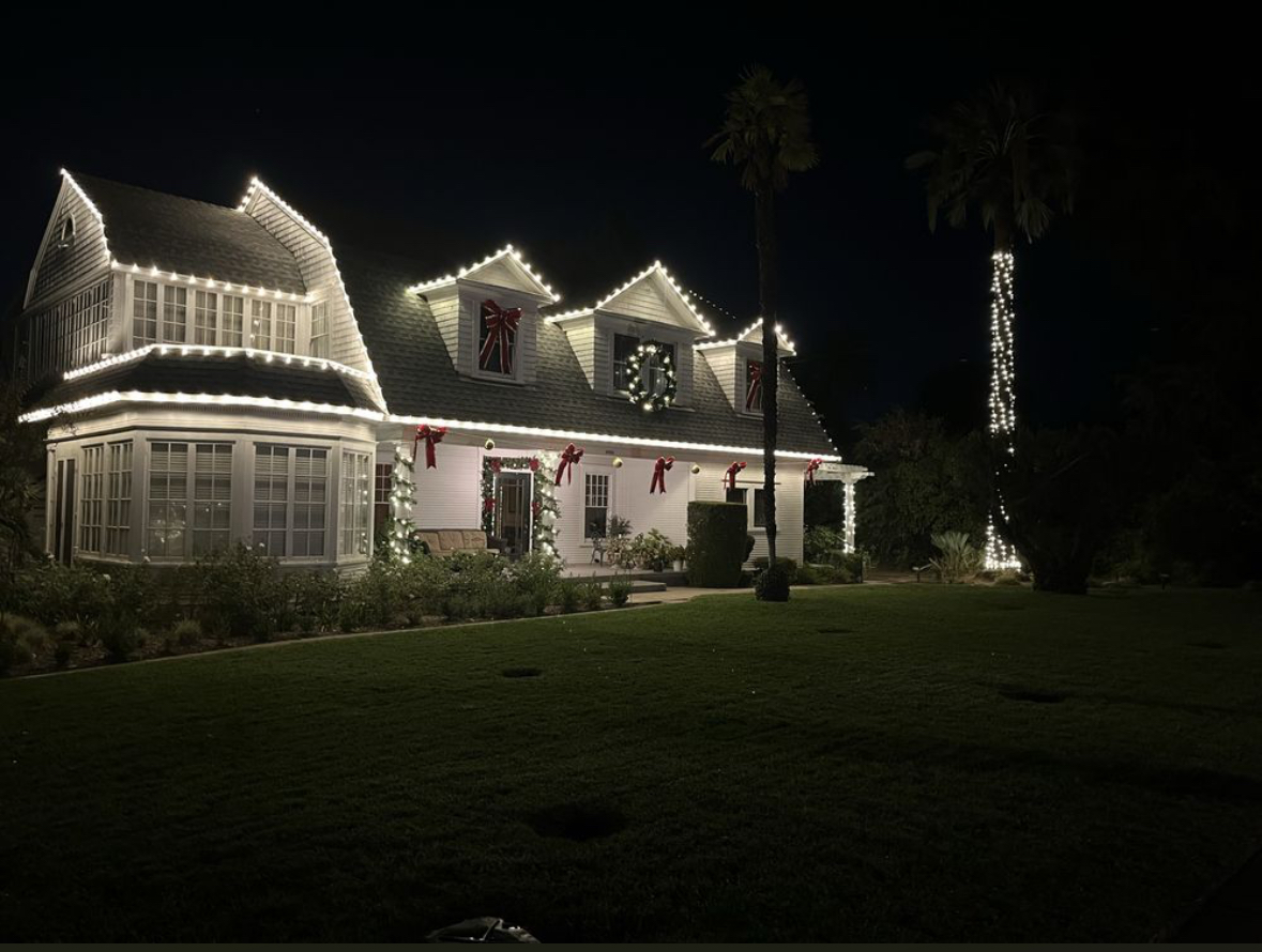 Warm-white C9 Christmas light installation on a San Diego home