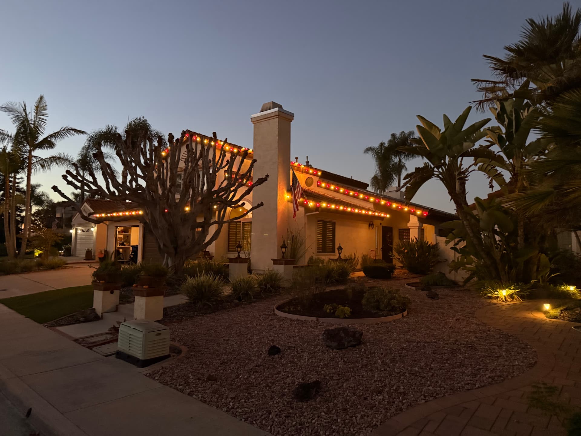 Commercial property lit at night — roofline and entry